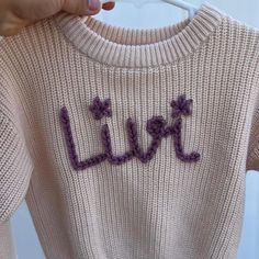 These sweaters are hand embroidered using Loops & Threads brand yarn. Perfect staple for your little one through the colder seasons.  More designs coming soon, open to any ideas or inspo! 😊 Cute Pink Sweater With Custom Embroidery, Cute Custom Embroidered Sweater For Winter, Cute Crochet Cotton Sweater, Cute Cotton Crochet Sweater, Cute Winter Sweater With Embroidered Text, Name Sweater, Toddler Gift, Toddler Gifts, Colorful Sweaters