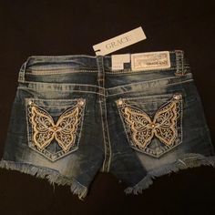 Grace In La Sz 25 Jean Shorts. Butterfly Design With Bling In The Wings On The Back Pockets As Well As On The Front Small Pocket. Never Worn. Bought In Nashville Sammy Sweetheart, Shorts With Designs, Hard Fits, Thrift Board, Low Rise Jean Shorts, Roblox Clothing, Y2k Shorts, Boutique Couture, Jean Pockets