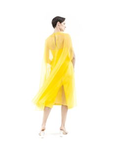 Dune Yellow cape gown made from silk organza, features wide A-line silhouette, round neck, midi length, hook-buttoning on the back and no lining.Offered with matching bustier midi dress sold separately (as shown on pictures) or with lining on request. Flower application is on request with no surcharge. 100% Silk organzaNo liningHook button on the backDry cleanMade in Milan Summer Party Silk Chiffon Midi Dress, Sheer Silk Evening Dress For Summer, Summer Silk Chiffon Midi Dress For Formal Occasions, Summer Party Silk Dress With Sheer Details, Sheer Silk Summer Party Dress, Sheer Silk Dress For Summer Parties, Sheer Silk Party Dress For Summer, Silk Party Dress With Overlay, A-line Organza Midi Dress For Evening