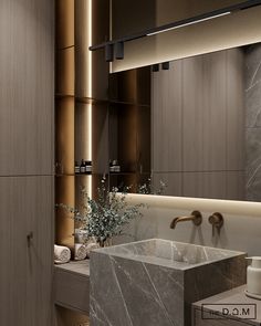 a modern bathroom with marble sink and large mirror