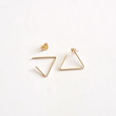 A simple and unique earring that is sure to get noticed when you want it! The open triangle measures 15mm per side and is made with solid sterling silver, 14k gold filled, and 14k rose gold filled. These are all great options if you have sensitive ears! <> The Open Triangle Measures 15mm per side <> Materials - .925 Sterling Silver, 14k Gold-Filled, & 14k Rose Gold-Filled <> Ear nuts come with either sterling silver, 14k gold fill, or 14k rose gold fill <> Posts measu Minimalist 14k Gold Filled Pierced Jewelry, Minimalist Triangle Jewelry For Pierced Ears, Gold Triangle Minimalist Earrings, Minimalist Gold Triangle Earrings, Minimalist Triangle Nickel-free Earrings, Minimalist Nickel-free Triangle Earrings, Minimalist Triangle Hoop Earrings As Gift, Minimalist Silver Threader Earrings In 14k Gold, Minimalist Hypoallergenic Yellow Gold Threader Earrings