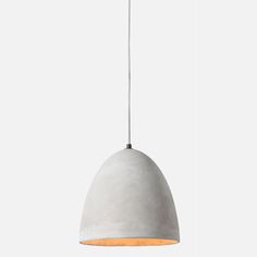 a white pendant light hanging from a ceiling