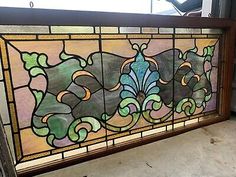 a large stained glass window sitting on top of a counter