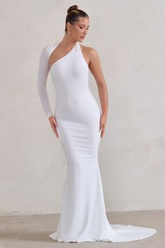 Channel Hollywood glamour as we enter wedding season in this floor-sweeping white showstopper. Crafted from flattering stretch jersey fabric. our Katarina maxi dress flaunts a wrapped cut-out neckline with a single long sleeve and an exposed shoulder. Katarina's long skirt trails from behind in theatric fashion. making you and your silhouette truly unforgettable.Features- Premium stretch jersey- Wrapped cut-out neckline- Single long sleeve- Bodycon fit- Fishtail skirt with train- Maxi length Sizing & FitModel is 5'6" and wears UK size 8 / US size 4Product InformationDesigned exclusively by Club L LondonDouble layered with good stretchPremium jersey in White (95% Polyester. 5% Elastane)SKU: CL129340005 Elastane Maxi Dress For Prom, Wedding Maxi Dress With Fitted Bodice And Asymmetrical Neckline, Wedding Maxi Dress With Asymmetrical Neckline And Fitted Bodice, Fitted Bodice Elastane Floor-length Maxi Dress, Stretch Maxi Length Wedding Gown, Stretch Maxi-length Wedding Gown, Wedding Maxi Dress With Sweep Train And Stretch, White Evening Dress With Asymmetrical Neckline, White Asymmetrical Neckline Evening Dress For Party