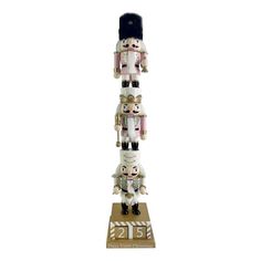 a tall wooden sculpture with many small figures on it