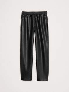 We selected a luxurious quality of vegan leather for this jogger-style pant, cut with a mid-rise and a tapered leg.  Mid rise (8. 75").  Slim, tapered leg.  Ankle length.  Elastic waistband with interior drawstring.  Front pockets.  Unlined.  Mid rise (8. 75").  Slim, tapered leg.  Ankle length.  Inseams: Petite/Short 25", Regular 27", Tall 30" Model: Size S, 5'10" (178cm). Style Pant, Petite Shorts, Fashion Joggers, Leather Pulls, Pull On Pants, Tapered Legs, Ankle Length, Black Pants, Banana Republic