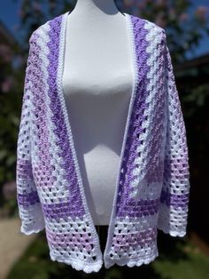 This cardigan is perfect for all occasions or just throw it on at the pool or beach. It can be dressed up or down. Extremely versatile statement piece White Oversized Cardigan For The Beach, Oversized White Cardigan For Beach, One Size Purple Spring Cardigan, Long Sleeve Shrug For Spring Beach Outings, One Size White Cardigan For Beach, One Size White Cardigan For The Beach, White One-size Cardigan For Beach, Purple Long Sleeve Cardigan For Summer, Lavender Granny Square