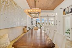 a large wooden table sitting in the middle of a room