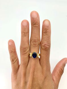 Vintage Sapphire Ring set with Created Sapphire in a diamond cut, flawless clarity & blue color, at size 10x8mm (3 cts). Gold Vermeil: 18k Gold over Solid 925 Sterling Silver ☞ made to last. Click here for ☞ Matching EarringsMatching Pendant ☞ Please ask me Details:• Created Sapphire in a flawless clarity• Sapphire: 10x8mm each, 3 Cts total, diamond cut• Dimensions: Band width ≈ 2.2mm, thickness ≈ 1.1mm• 18k Gold Vermeil SKU 2284 Elegant Sapphire Gemstone Signet Ring, Elegant Sapphire Signet Ring With Gemstone, Timeless Blue Gemstone Signet Ring, Elegant Sapphire Signet Ring With Polished Finish, Elegant Blue Oval Cabochon Moonstone Ring, Elegant Blue Oval Cabochon Signet Ring, Elegant Oval Sapphire Signet Ring, Elegant Sapphire Signet Ring Hallmarked, Elegant Blue Sapphire Signet Ring