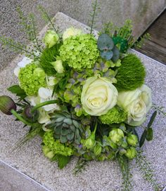 a bouquet of flowers sitting on the ground