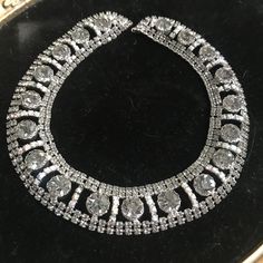 Couture Large Rhinestone Necklace, high end collectible, Choker necklace, Vintage collectible, costume jewelry Rhinestone statement necklace in very good vintage condition.  Measures 15 1/2 inches long by almost 1 inch wide.  Very pretty collectible piece. Perfect for any wardrobe. Nice looking on. ps22 Round Crystal Necklaces For Party, Crystal Necklaces For Party, Bling Crystal Costume Necklaces, Glamorous Round Necklace With Jewels, Glamorous Round Necklaces For Party, Cubic Zirconia Costume Bridal Necklace For Parties, Glamorous Round Party Necklaces, Silver Costume Jewelry Choker, Evening Rhinestone Necklace With Jewels