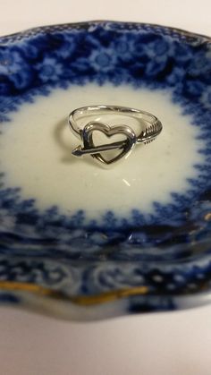 "Thanks for shopping our vintage estate store. We tend to sell well below wholesale and truly hope you enjoy all of our items. Many of the items are one of a kind, so please enjoy scrolling through the pictures and hopefully something will catch your eye. Brown spots are from the reflections. Estate nice sterling silver 925 arrow heart cupid ring. Custom made item for our shop. Ring size: please select size Setting: 3/8\" 10mm Band witdth: 2mm Weight: 2.0 grams Beautiful ring, one of a kind." Heart-shaped Anniversary Ring With Hallmark, Heart-shaped Hallmark Ring For Anniversary, Valentine's Day 925 Silver Open Heart Ring, Vintage Heart Cut Ring As A Gift, Vintage Heart Cut Ring As Gift, Vintage Heart Cut Heart Ring As Gift, Vintage Rings For Gifts, Vintage Rings With Hallmark As Gift, Vintage Promise Ring For Valentine's Day