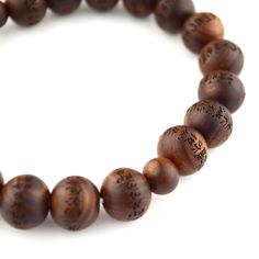 Japanese Sendan Wood Chinaberry Wood Heart Sutra Beads Bracelet Material : Sendan wood (Chinaberry wood), Silk elastic cord Length : about 16cm / 17cm / 17cm Head bead : about 10mm / 12mm / 15mm Main beads : about 7mm / 10mm / 12mm Handmade in Kyoto, JAPAN The beads of this bracelet have Heart Sutra on every beads. Melia azedarach ( Sendan Wood) , commonly known by many names, including chinaberry tree, Pride of India, bead-tree, Cape lilac, syringa berrytree, Persian lilac, and Indian lilac, is Brown Wooden Bracelet With 8mm Beads, Brown Wooden Bracelets With Round Beads, Brown Wooden Beads Bracelet, Brown Wood Beaded Bracelets, Brown Wooden Beaded Bracelets With 8mm Beads, Wooden Bracelets With Round Beads For Gifts, Wooden Beaded Bracelets For Gifts, Wooden Beaded Bracelets As Gift, Natural Wood Round Beads Bracelet Gift