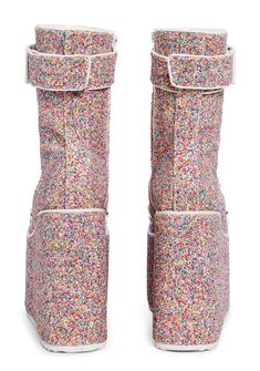 cuz they know betta than to double-cross ya babe! You're sweet but deadly in these candied platform boots that have a multicolored glitter construction, ultra high wedge heels and treaded platforms, D-ring lace ups, a wrapped calf strap with an adjustable buckle, and side zip closures. Multicolor High-top Party Boots, Multicolor Round Toe Platform Boots For Party, Multicolor Synthetic Boots For Party, Multicolor Synthetic Party Boots, Multicolor High Heel Platform Boots For Party, Multicolor Platform Boots For Parties, Multicolor High-top Platform Boots, Party Platform Multicolor Boots, Multicolor Platform Boots With Synthetic Material