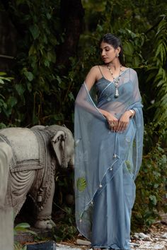 Steal Blue Organza Saree Blouse, Flower Printed Sari for Women, Indian Wedding or Party Wear Sari Dress Item Contain - Saree Blouse Material : Organza, Crosia Sleeves : Sleeveless Color : Steal Blue Model Height : 5.8'' Approx. Fit Type : Regular Fit Size - (XS), (S), (M), (L), (XL), (2XL) Size chart attached in images mentions garment measurements in inches. For any sizing queries or getting a customized fit, please message us on Etsy. WASH & CARE Gentle hand wash separately from other garments Elegant Organza Lehenga For Summer, Elegant Summer Organza Lehenga, Summer Party Saree Sets, Summer Reception Dupatta In Georgette, Summer Reception Georgette Dupatta, Bollywood Style Organza Summer Dress, Summer Bollywood Organza Dress, Summer Bollywood Style Organza Dress, Festive Blue Wedding Pre-draped Saree