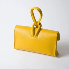 Bold and beautiful, this striking clutch is elegant and simple and has been our most popular bag this season! Comes with a removable crossbody strap. Find the color that fits you best and feel stylish and prepared for anything! Italian leather is the most recognizable leather in the entire world because of its unique characteristics including a vibrant color palette. The finest quality Italian leather, including vegetable tanned leather comes from Tuscany, the heart of Italy. Leather craftsmansh Luxury Clutch With Adjustable Strap And Top Handle, Modern Evening Bag With Top Handle And Adjustable Strap, Trendy Leather Evening Bag With Detachable Handle, Modern Pouch Flap Bag With Top Carry Handle, Elegant Pouch Flap Bag With Top Carry Handle, Elegant Flap Pouch Bag With Top Carry Handle, Trendy Leather Clutch Box Bag, Versatile Clutch Flap Bag For Daily Use, Versatile Flap Bag Clutch For Daily Use