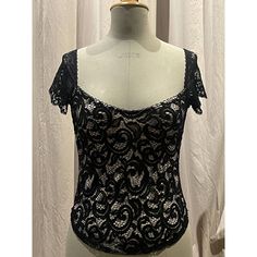 Black Floral Scroll Stretch Lace , Lined In Nude. Very Low Scoop Neck And Wide Set Cap Sleeves In Vintage Scallop Lace. Photographed On A Size 8 Mannequin Unworn, Pristine. Black Tops With Sweetheart Neckline For Party, Black Party Top With Sweetheart Neckline, Black Sweetheart Neckline Top For Party, Black Coquette Tops For Party, Black Coquette Party Tops, Party Tops With Lace Trim And Underbust Shape, Coquette Lace Trim Top For Night Out, Gothic Lace Tops For Party, Flirty Lace Trim Top For Night Out