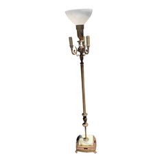 an old fashioned floor lamp on a white background