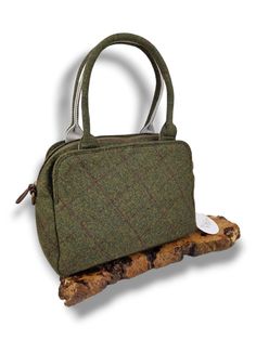 Introducing the stylish Cora tweed Top handle tweed bag as part of our range of tweed. Upgrade your style with this timeless piece, that combines both fashion and function. Elevating the classic material into contemporary fashion.  The bag boasts an elegant and classic design that exudes sophistication. The backpack features a zip closure providing security for your belongings. There are also two additional compartments either side of the zip, secured by a magnetic closure. The reverse also dons Classic Rectangular Tweed Shoulder Bag, Classic Tweed Rectangular Bag, Classic Rectangular Tweed Bag, Tweed Satchel Bag For Everyday Use, Fall Tweed Shoulder Bag, Rectangular Tweed Bag For Fall, Rectangular Tweed Bags For Fall, Fall Tweed Shoulder Bag For Everyday, Classic Tweed Bags For Everyday Use