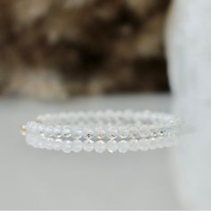 Brand New, Unused Gorgeous Dainty Genuine White (Clear) Topaz Beaded Gemstone Bracelet. Beads Are 1/8” In Diameter And Strung On Strong 6.75” Clear Cord, And Finished With Solid Sterling Silver .925 Clasp. This Bracelet Is Brand New And Has Never Been Worn! So Pretty Worn Alone, Sparkly And Delicate, Or Stacked With Other Bracelets. Each Bead Is Covered In Tiny Facets And Catches Light Beautifully. Bead Height 1/8” Total Bracelet Length 6.75” Weight 2g White Topaz Symbolizes Hope, Love, And Happ Elegant Clear Beaded Bracelets With Adjustable Fit, Elegant Adjustable Clear Beaded Bracelets, Elegant Crystal Rondelle Bracelet With Faceted Beads, Elegant Rondelle Faceted Beads Crystal Bracelet, Elegant Crystal Bracelet With Clear Round Beads, White Elegant Beaded Bracelets With Gemstone Beads, Stackable White Moonstone Jewelry, White Sterling Silver Stackable Bracelets, White Moonstone Stackable Jewelry