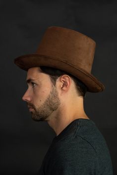 "Deluxe 6\" Brown Steampunk Faux Suede Top Hat from Nicky Bigs Novelties. Brown steampunk top hat with inner sweatband for better, more comfortable fit Measures about 6\" tall, \" brim. Approximately 2- inches in circumference in the interior without the sweatband. The sweatband allows for a range of sizes. Fits approximately 50cm to 57cm. Great for Adults and Children. Made of soft suede like material." Vintage Hat Costume Accessories For Cosplay, Vintage Hat For Cosplay, Fitted Punk Hats For Cosplay, Halloween Cosplay Costume Accessories With Tall Crown, Vintage Top Hat With High Crown For Cosplay, Steampunk Brimmed Mini Hats For Cosplay, Steampunk Brimmed Halloween Costume Hat, Vintage High Crown Top Hat For Cosplay, Vintage High Crown Costume Hats For Cosplay