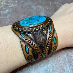 Artisan Blue Cuff Bracelet For Festivals, Adjustable Blue Engraved Cuff Bracelet, Unique Blue Cuff Bracelet For Festival, Traditional Leather Jewelry For Festival, Hand Painted Bohemian Bangle Jewelry, Bohemian Hand Painted Bracelet Jewelry, Bohemian Hand-painted Bangle Jewelry, Bohemian Hand Painted Bangle Jewelry, Bohemian Turquoise Hand Painted Jewelry