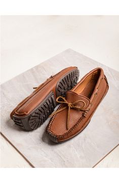 Double-layer moosehide defines a comfort-minded driving loafer paneled with soft leather. Leather upper and lining/rubber sole Imported Casual Swift Leather Moccasins With Plain Toe, Casual Brown Swift Leather Loafers, Rugged Leather Moc Toe Loafers, Rugged Leather Loafers With Round Toe, Brown Slip-on Moccasins With Suede Lining, Brown Swift Leather Casual Moccasins, Fall Leather Slip-on Moccasins, Rugged Leather Moccasins With Rubber Sole, Casual Brown Swift Leather Moccasins