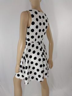 "Women's Dress Black White Polka Dot Classic Vintage by ALYA SIZE S Black and white LARGE polka dots sleeveless pull over dress with scoop neck. High quality. Excellent like new condition. Easy to wear casual chic vintage for the disco sporting life. MEASUREMENTS: Length - 32.5\" Bust (underarms to underarms) - 33-36\" Waist - 27\"unstretched Hips -22\"x2 MODEL STATS: Ht. - 5' 8.5\" Bust - 34\" Waist - 25\" Hips - 35\" *Please check measurements to ensure proper fit and remember to allow extra r Knee-length Polka Dot Sleeveless Summer Dress, Summer Polka Dot Sleeveless Knee-length Dress, Polka Dot Knee-length Sleeveless Dress For Spring, Polka Dot Sleeveless Lined Dress, Polka Dot Sleeveless Daywear Dress, Polka Dot Sleeveless Summer Party Dress, Fitted Polka Dot Sleeveless Dress For Spring, Polka Dot Sleeveless Dress For Summer Party, Fitted Polka Dot Sleeveless Casual Dress