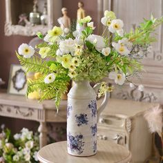 a vase filled with flowers sitting on top of a table