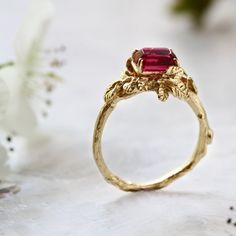 FREE SHIPPING WORLDWIDE.Gold filled ring with fuchsia CZ stone.After many years of rumors, the treasure of precious stones was found. Precious stones from faraway lands with love for bold colors.The treasure was located within a raspberry bush in the secret garden.The Secret Garden collection is inspired by the living sculptures designed and created by nature. All of the jewelry is personally designed and sculpted by hand in stunning details by Noga Berger.This ring is for women with strong love Nature-inspired Sapphire Ring For Anniversary, Heirloom Ruby Jewelry For Promise, Unique Rings With Lost Wax Casting As Gift, Heirloom Jewelry With Accent Stones For Proposal, Ruby Gemstone Jewelry For Promise, Promise Ruby Gemstone Jewelry, Spiritual Ruby Rings For Weddings, Spiritual Ruby Wedding Rings, Emerald Cut Ruby Ring With Accent Stones As Gift