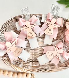 small pink and white bows in a wicker basket