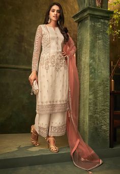 Net Pakistani Suit in Off White This Semi-stitched Attire with Poly Shantoon Lining is Highlighted with Resham and Patch Border Work. Crafted in Notched Round Neck and Full Sleeves Available with a Poly Shantoon Palazzo in Off White and a Net Dupatta in Peach The Kameez and Bottom Lengths are 46 and 38 inches respectively Do note: Accessories shown in the image are for presentation purpose only and length may vary upto 2 inches.(Slight variation in actual color vs. image is possible). Luxury Organza Salwar Kameez In Off White, Luxury Off White Salwar Kameez With Mirror Work, Luxury Off White Unstitched Suit With Zari Work, Luxury Bollywood Style Off White Churidar, Luxury Off White Bollywood Churidar, Luxury Traditional Off White Salwar Kameez, Luxury Off-white Unstitched Suit For Eid, Luxury Off-white Salwar Kameez With Naqshi, Luxury White Salwar Kameez For Traditional Ceremonies