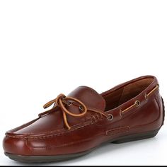 From Polo Ralph Lauren, The Men's Roberts Boat Style Leather Drivers Feature: Leather Upper Rawhide Laces Thread Through Metal Grommets At The Sides And Tie At The Vamp Rounded Toe Construction Slip-On Styling Cotton Lining Reinforced Heel Padded Leather Insole Rubber Nub Outsole Masculine Leather Loafers With Round Toe, Leather Loafers With Round Toe, Casual Slip-on Moccasins With Goodyear Welt Construction, Classic Brown Leather Boat Shoes, Leather Moc Toe Boat Shoes For Business Casual, Masculine Leather-lined Moccasins With Round Toe, Masculine Brown Leather Loafers, Casual Leather Moc Toe Dress Shoes, Casual Leather Dress Shoes With Moc Toe