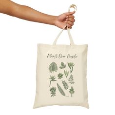 This 100% cotton bag comes in one size - 15" x 16"- perfect for everyday wear. The bag features 20" handles (made from the same canvas), making it easy to carry even with a week's worth of shopping. .: 100% cotton canvas\n.: Heavy fabric (12 oz/yd² (406.9 g/mn.: Sewn-in label Botanical Canvas Bag For Everyday Use, Botanical Cotton Canvas Bag For Everyday Use, Botanical Cotton Canvas Bag For Daily Use, Botanical Canvas Gift Bag For Everyday Use, Botanical Cotton Tote Bag, Botanical Style Cotton Tote Bag, Cotton Bags With Plant Print For Everyday Use, Botanical Bags With Plant Print For Everyday Use, Botanical Cotton Canvas Tote Bag