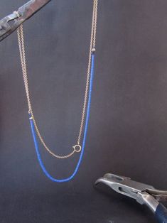 If you want to pay with PayPal, please contact me. Necklace details: * The necklace made from 14 karats solid yellow gold, and Blue Lapis stones. * Gold chain length: 15.7inch/ 40cm'. * Lapis chain length: 7.9inch/ 20cm. * the total length of the necklace: 23.6inch/ 60cm. Beautiful gold and Lapis chain necklace. sophisticated in its simplicity. The necklace can also be used as a bracelet. IF YOU WANT A CUSTOM necklace please contact me before purchase. When I write Handmade I really mean it. eac Blue Lariat Jewelry With Adjustable Chain, Fine Jewelry With Blue Delicate Chain, Blue Fine Jewelry With Delicate Chain, Blue Delicate Chain Fine Jewelry, Blue 14k Gold Necklace With Adjustable Chain, 14k Gold Necklace With Blue Adjustable Chain, Blue 14k Gold Jewelry With Adjustable Chain, Handmade 14k Gold Blue Jewelry, Handmade Blue 14k Gold Jewelry