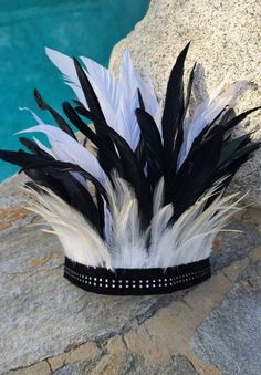 This handmade feather head crown is perfect to wear with your tribal outfit for any upcoming festival event.  Enchant them all with this feather crown featuring a suede band with rhinestones.  It is comfy, lightweight, and made with natural feathers. Height:10 inches from the base of the band to the top. One size fits all.  ༓❈ Made in USA ❈༓ Crown Black And White, Black And White Feather, Feather Crown, Indian Feathers, Head Crown, Crown Black, Feather Headband, White Feather, White Feathers