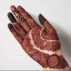 a hand that has some henna on it