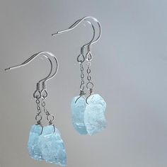 Natural Light Blue Aquamarine Earrings . Each aquamarine stone is uniquely shaped, showcasing its natural brilliance and clarity. this earrings  adds a touch of sophistication to any outfit. Known for its calming and healing properties, aquamarine is believed to promote peace and clarity.  March Birthstone . Necklace made with 925 sterling silver Stone Size:12-14mm Blue Aquamarine Nickel-free Earrings, Nickel Free Blue Aquamarine Earrings, Blue Aquamarine Gemstone Earrings, Blue Aquamarine Earrings Nickel Free, Aquamarine Dangle Earrings With Ear Wire, Blue Drop Earrings With Natural Stones, March Birthstone Necklace, Aquamarine Earrings, Crystal Light