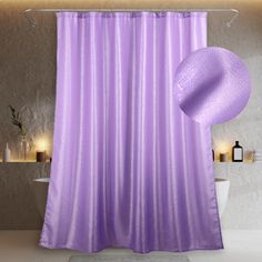 a bathroom with a purple shower curtain next to a toilet