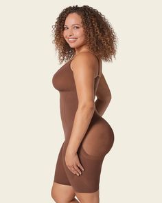 This bodysuit is the ultimate in technology, comfort, and shaping. It's made of our signature SkinFuse® fabric for moderate compression to shape your curves. Targeted compression adds a little extra shaping in the tummy and waist to gently create an hourglass effect. This bodysuit covers from the bust down to the knees and a flex-fit design at the thighs provides extra flexibility for comfortable wear. Lighter fabric in the bust and bottom prevent flattening. The bodysuit's seamless design makes Shaping Bodysuit, Legging Sport, Compression Fabric, Support Bras, Active Wear Leggings, Body Shapers, Shop Swimwear, Second Skin, Fitted Dress