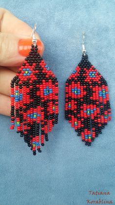 These handmade unique earrings with abstract floral print are made of high-quality Czech beads and strong synthetic thread. I use my author's scheme . They are elegant, fashionable, and highly versatile, suitable for everyday wear. Color: Black,red,green,blue. 100% hand made with love! Copy without my permission is prohibited Measurements: Length-8.5 cm (3.14 inch)(with schwenze) , Width -3 cm (1.18 inch) Materials: Silver plated ear hooks Czech glass beads Nylon Thread It's recommended to alway Traditional Red Earrings With Black Beads, Traditional Handmade Red Beaded Earrings, Red Earrings With Black Beads As Gift, Red Earrings With Black Beads For Gift, Traditional Handmade Black Beaded Earrings, Chandelier Boho, Beaded Earrings Native, Lily Painting, Unique Chandeliers