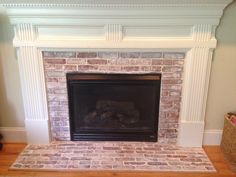 a fire place in a living room next to a wall