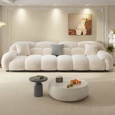 a large white couch sitting in a living room