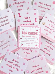 pink and white cards with words on them