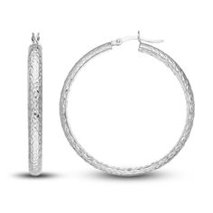 Dynamic 40mm round tubes are embellished with distinctive diamond-cut patterns on the inside and outside in these striking women's hollow hoop earrings. Fashioned in 14K white gold, the earrings secure in place with hinged backs. Silver Diamond Cut Hoop Earrings, Silver Round Diamond Cut Hoop Earrings, Pierced Round Hoop Earrings In White Gold, Pierced Round White Gold Hoop Earrings, Luxury Round Hoop Earrings Hallmarked, Luxury Hallmarked Round Hoop Earrings, Luxury Hallmarked Hoop Earrings, White Gold Round Hoop Earrings With Diamond Cut, Diamond-cut White Gold Hoop Earrings