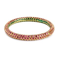 Traditional Indian Emerald Ruby Red stone Studded Punjabi Jadau Delicate and Elegant Bangles. A classic case of chic Indian jewelry with high grade stones and finish ~Comes in sizes 2.2, 2.4, 2.6, 2.8 ~Comes with an openable screw Emboss Work, South Indian work, Temple work, Indian Bangles, Punjabi Jadau, Pakistani Jadau STYLE TIP - Style this with Classic Ethnic Or Indo western wear or lehengas. A perfect match with almost any traditional classic. We love to pair this with rich Banarasi sarees Traditional Ruby Bangle For Festive Occasions, Festive Ruby Temple Jewelry Bracelets, Elegant Red Bracelet With Stone Work, Elegant Red Bracelets With Stone Work, Festive Ruby Temple Jewelry Bracelet, Traditional Ruby Bangle, Festive Ruby Round Bangle, Festive Round Ruby Bangle, Red Bangle With Intricate Design For Diwali