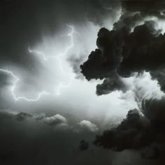 black and white photograph of storm clouds with lightning