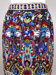 "This is a breath-taking vintage designer couture skirt! It's fully embellished with sequins, jewels and beading and is in perfect condition! Waist - 26\" Hips - 35\" Length - 22\" This item comes from a pet-free and smoke-free home. If you would like more info or have any questions, please don't hesitate to ask!" Elegant Multicolor Skirt For Evening, Elegant Multicolor Evening Skirt, Luxury Embellished Evening Skirt, Fitted Multicolor Sequin Skirt, Fitted Bohemian Embellished Skirt, Glamorous Beaded Evening Skirt, Glamorous Evening Beaded Skirt, Embellished Multicolor Skirt For Party, Festive Embellished Fitted Skirt