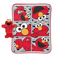 the sesame street blanket is next to a red stuffed animal and it's matching pattern