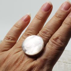 A beauty... quality Mother of pearl shell very white elegant ring and amazing round inlaid bezel set on 925 solid silver, quality solid and unique jewelry hypoallergenic silver  Dimensions Length : 26 mm (1.00")  Width : 26 mm (1.00") Height : 5 mm (0.20") Weight 12.3 grams Size : 7 and 8 US,CA / 54 and 57 France / -O- and -Q- UK sizing Resizing is available for $20-USD / takes a extra 7 to 10 days before shipping Elegant Round Mother Of Pearl Ring, White Mother Of Pearl Wedding Ring, Classic Mother Of Pearl Ring As A Gift, Wedding Pearl Ring With Mother Of Pearl, Classic Mother Of Pearl Ring As Gift, Classic Mother Of Pearl Ring For Gift, Wedding Pearl Ring In Mother Of Pearl, Elegant White Mother Of Pearl Ring, White Mother Of Pearl Round Pearl Ring